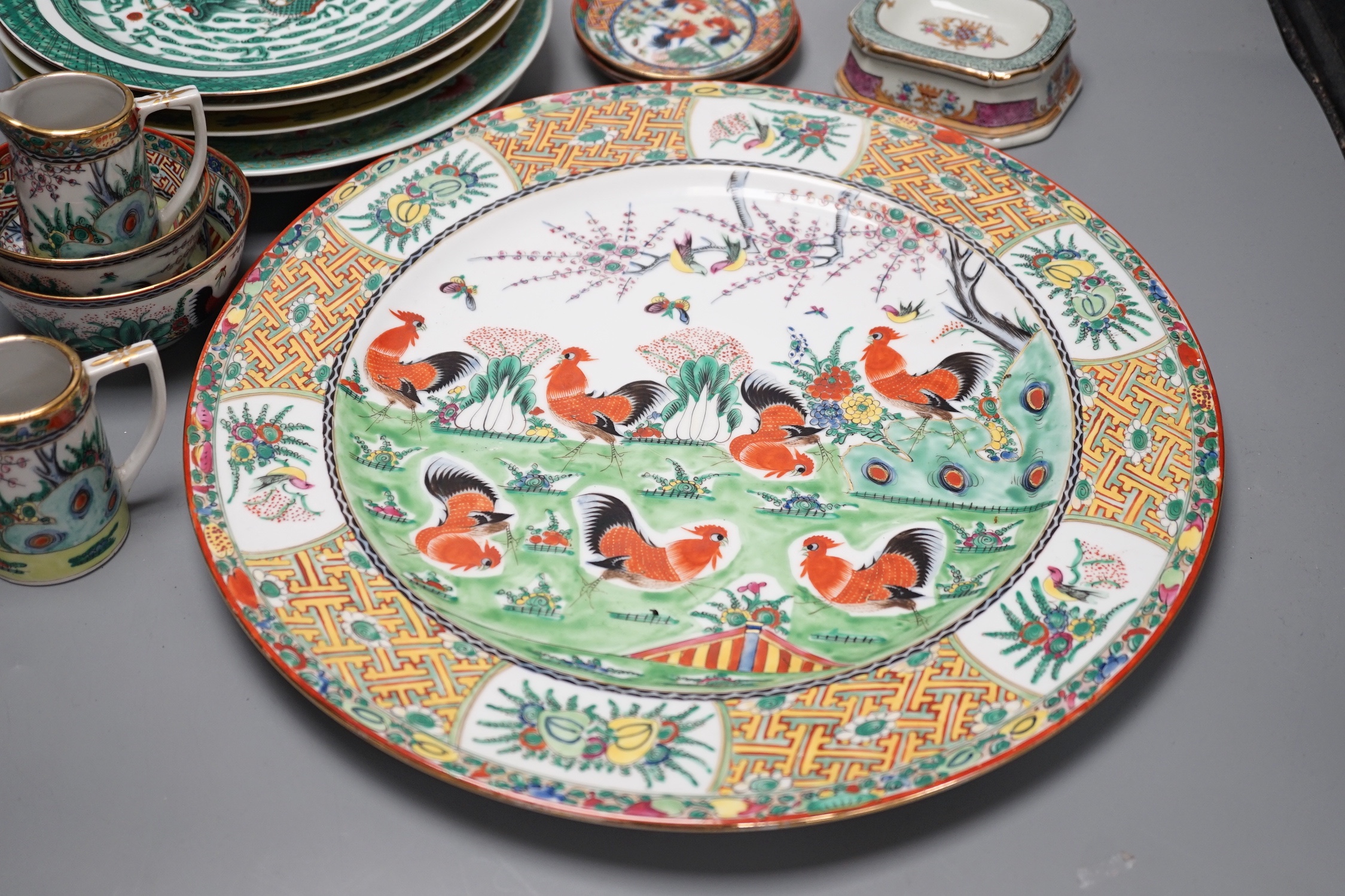 A group of 20th century Chinese enamelled porcelain plates dishes bowls and two jugs, Charger 38.5 cm